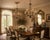 Romantic and sculptural, this pair of wrought iron chandeliers features hand-forged branches adorned with faceted crystal...