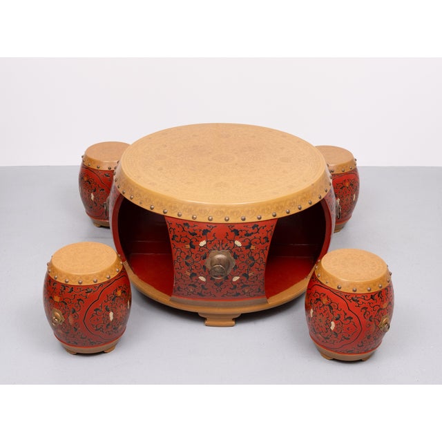 Love this oriental style Drum table. Made of Wood and comes with a surprise. Inside the table behind the curved panels are...