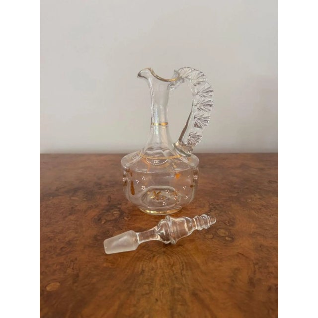 Stunning quality antique Victorian ewer, having a stunning quality antique Victorian ewer with a shaped crimped handle to...