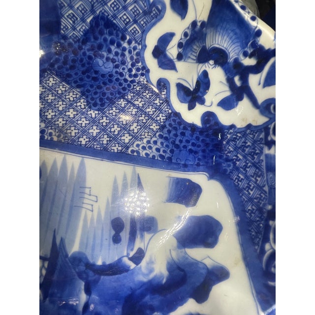 Japanese blue and white porcelain, specifically crafted in the Ko-Imari (Old Imari) style, likely dating to the Edo period...