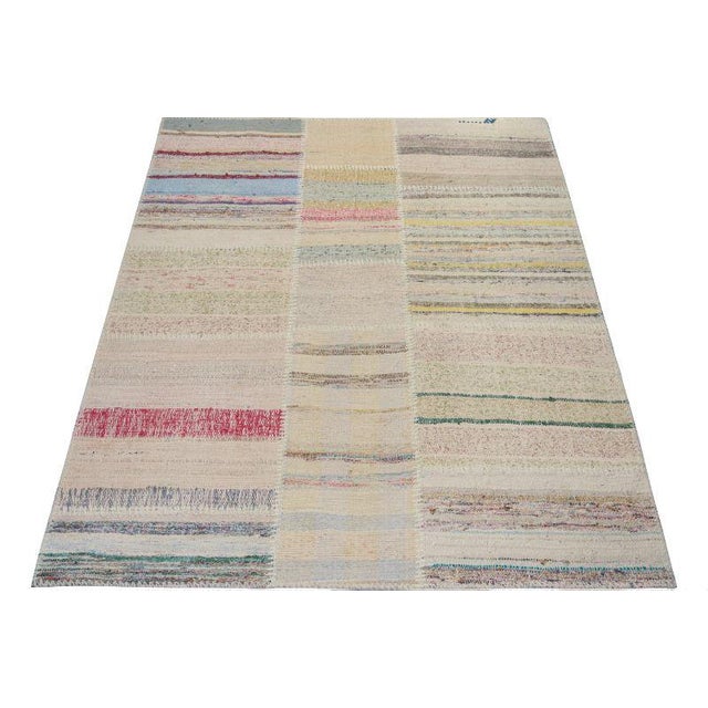 Handwoven in wool, Rug & Kilim presents a 4x5 contemporary rug from their innovative new patchwork kilim collection. On...
