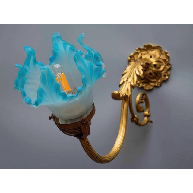 This wall lamp, made around 1900, is a wonderful example of historical lighting that combines elegance and artistic...