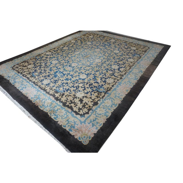 1920s Hand Knotted Pile Allover Floral Blue Antique Wool Rectangle Rug, Circa Date: 1920s. This exceptional example of...