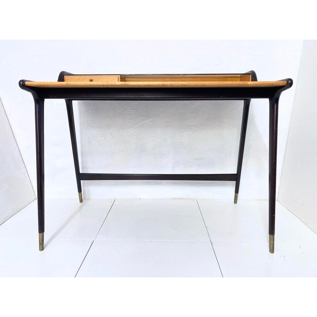 Small desk from the 1950s. Design attributed to Reinhold Stotz. Wood (beech, dark stained, cherry), cherry veneer on the...