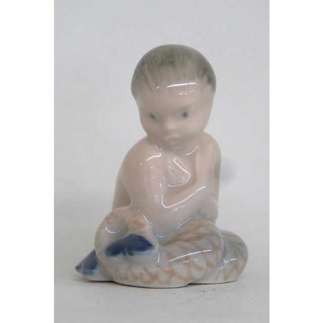 This adorable Little Mermaid Figurine is made out of porcelain. This lovely miniature piece was made by Royal Copenhagen...