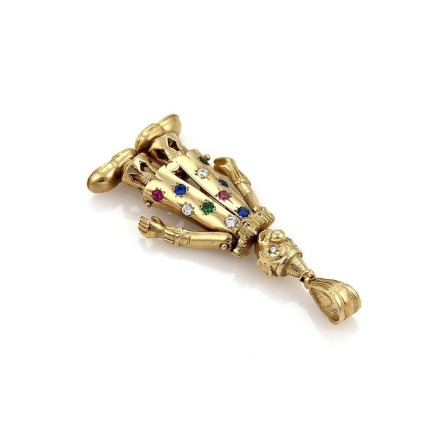 The Diamond & Gems 9k Yellow Gold Animated Large Clown Charm Pendant is a unique and eye-catching piece of fine jewelry....
