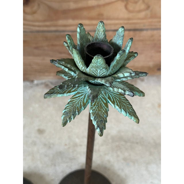Fabulous pair of decorative metal palm tree candlesticks featuring beautifully sculpted tropical fronds with a verdigris...