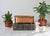 Vintage oval copper planter or jardiniere with decorative brass claw feet and an ornate brass rim. Features a smooth...