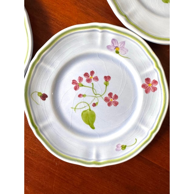 Charming set of four vintage French bread plates by Longchamp, beautifully hand-painted with delicate pink floral sprays,...