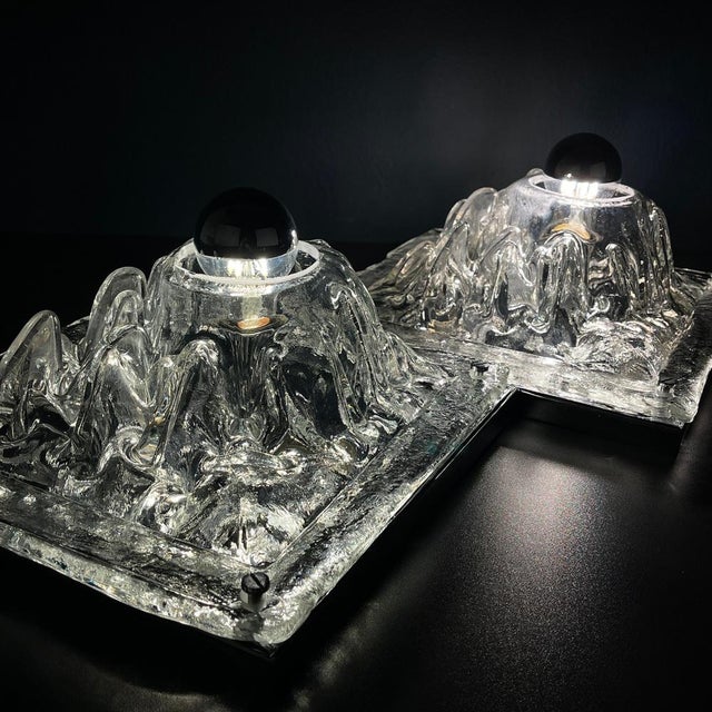 Elevate your vintage home decor with the enchanting Murano wall lamps, known as "Polifemo," designed by Angelo Brotto for...