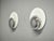 Sculptural pair of italian space age wall lights dating from the 1970s. The sconces feature a distinctive layered circular...