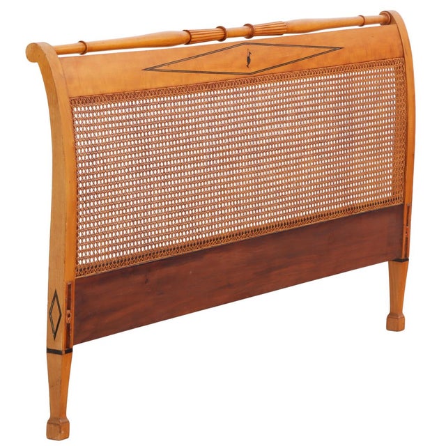 This unique mid-century queen size headboard features beautiful caning and a sleek, distinctively mid-century, inlay...