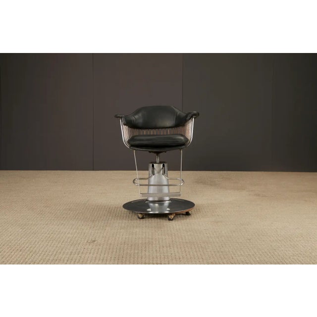This unique vintage salon or barber’s chair, which could also work well as a barstool, blends bold industrial function...
