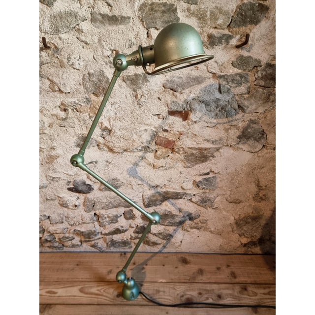 This original Jieldé industrial lamp is a classic example of mid-century French design, created by Jean-Louis Domecq....