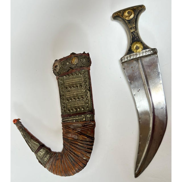 Antique Yemeni Jambiya Dagger with Silver-Mounted Scabbard, Early 20th Century A highly collectible Middle Eastern...