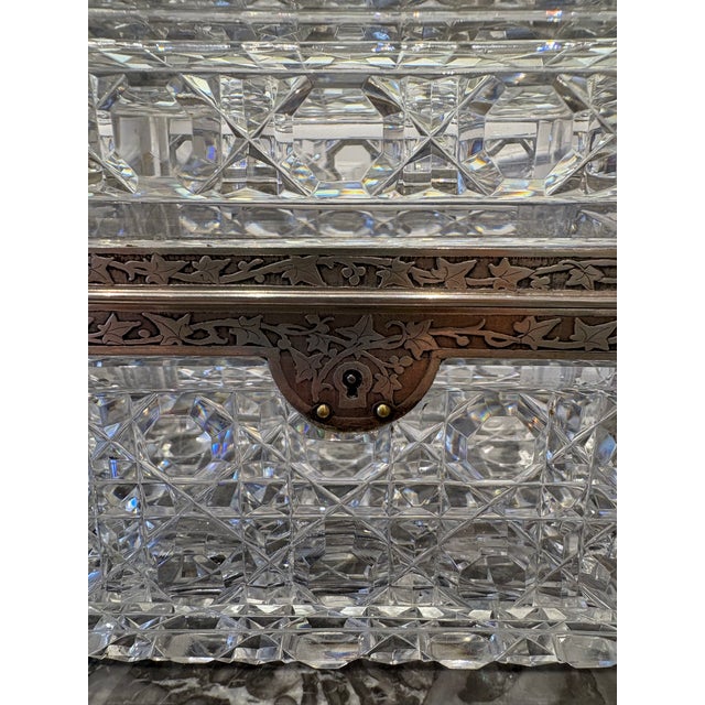 Bacaratt Crystal and etched Sterling Silver trinket box. Excellent condition. A beautiful collectors piece. Purchased in...