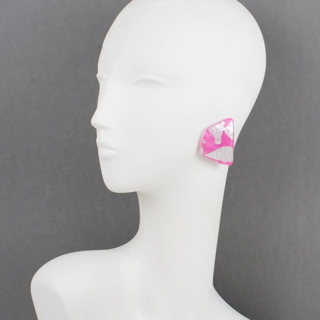 These stunning Anne and Frank Vigneri Lucite or resin clip-on earrings feature a dimensional curved geometric design. The...