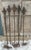Set of 5 antique fence posts with substantial fleur-de-lis type finials used as plant supports or garden / interior decor....