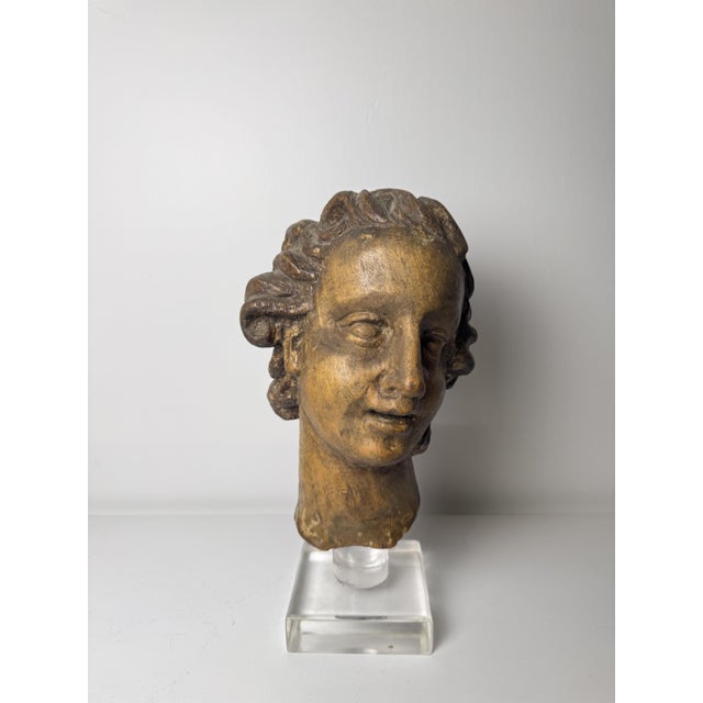 Genoese wooden sculpture depicting the head of an angel from the 17th century. The sculpture is made of carved wood and...