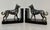 Elegant pair of French Art Deco bookends produced during the 1930s. Each bookend features a stylized wolf dog standing...