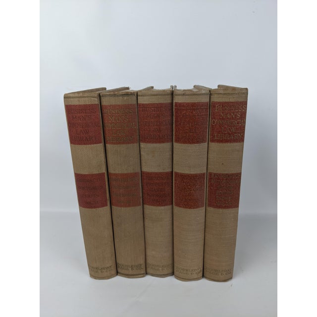 A collection of five antique volumes from Albert S. Bolles's Business Man’s Commercial Law Library, published in 1919 by...