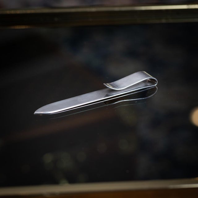 Vintage 20th century french solid silver hermès letter opener and letter clip, crafted in a sleek, minimalist design. The...