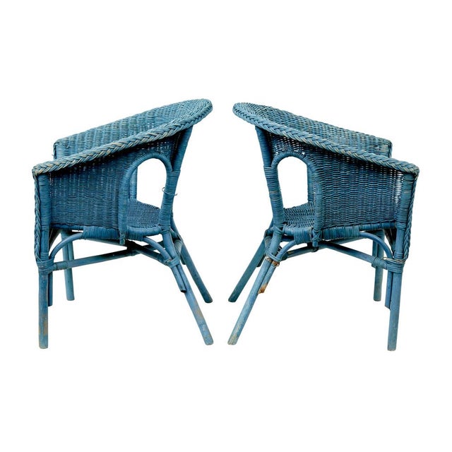 pair of mid century blue painted wicker armchairs circa 1950. good quality pair of chairs purchased on our travels around...