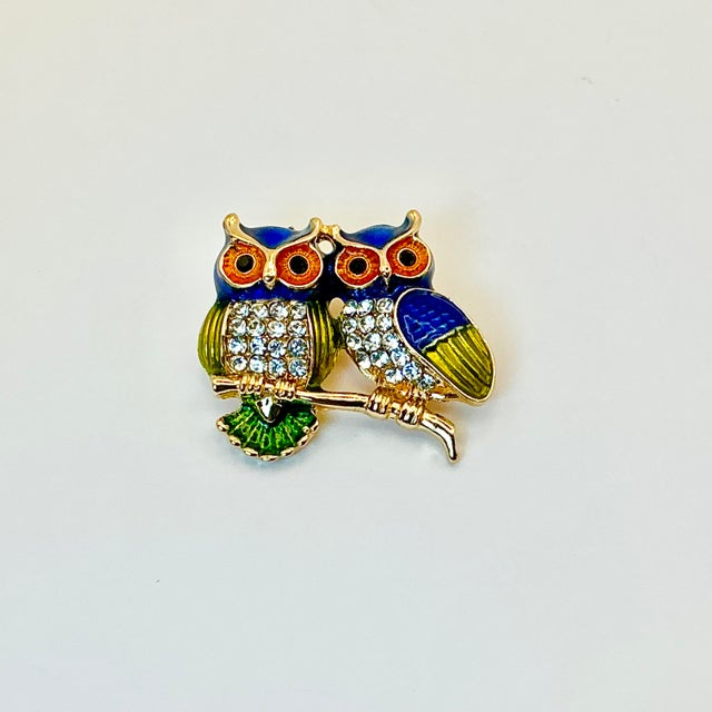 This little Owl Brooch is adorable. It features two rhinestone-clad owls sitting on a gold tone tree branch. The owl...