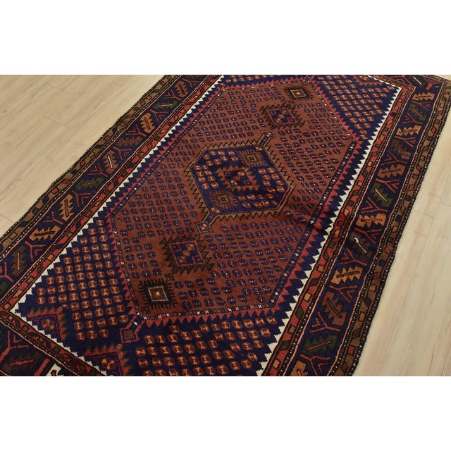 This authentic vintage tribal Zanjan rug is hand-knotted with fine wool and natural dyes. This nomadic oriental rug...