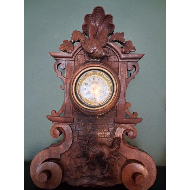 This black forest style clock holder have a structural completely wood with carved Fox & Bird. Stones carved castlle...