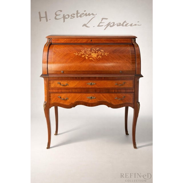 By H & L Epstein | Cabinetmaker: E. W. Vickerman Inlaid Wood • Bronze Mounts • England, Mid-20th Century This refined...