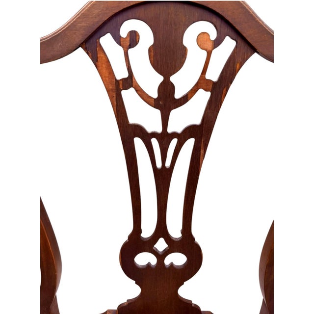 Elegant circa 1920s American Federal / Hepplewhite Revival dining armchair featuring a decorative pierced splat, shaped...