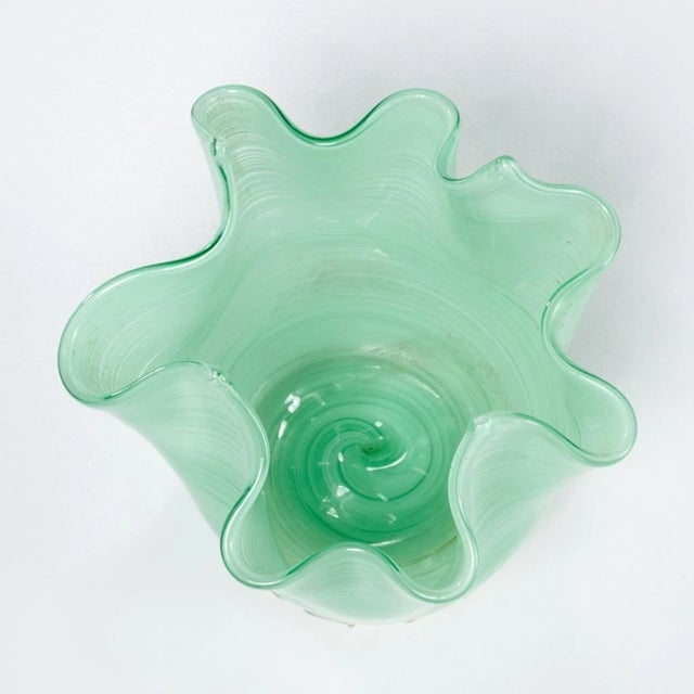 The vase features rich emerald-green glass with a smooth, glossy finish that beautifully reflects light, making it a...