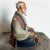 This vintage Hakata Mimasu clay doll portrays an elderly Japanese man seated in meditation, crafted with remarkable detail...