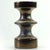 A decorative ceramic candle holder for one candle in complex shades of metallic brown, designed by Cari Zalloni for the...