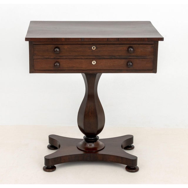 William IV Rosewood Work Table, early 19th century, with two drawers on pedestal base on four bun feet. 29.5" H x 26.75" W...