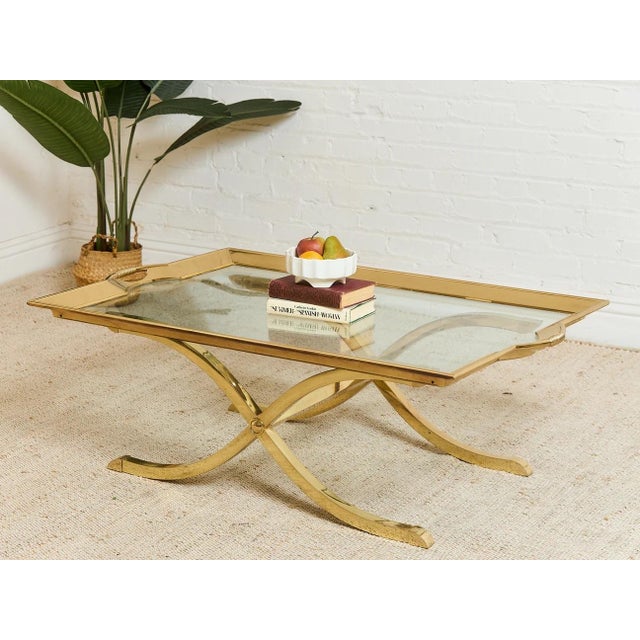 Polished Brass Cocktail Coffee Table by La Barge Hollywood Regency coffee table showcases the beauty of vintage design and...