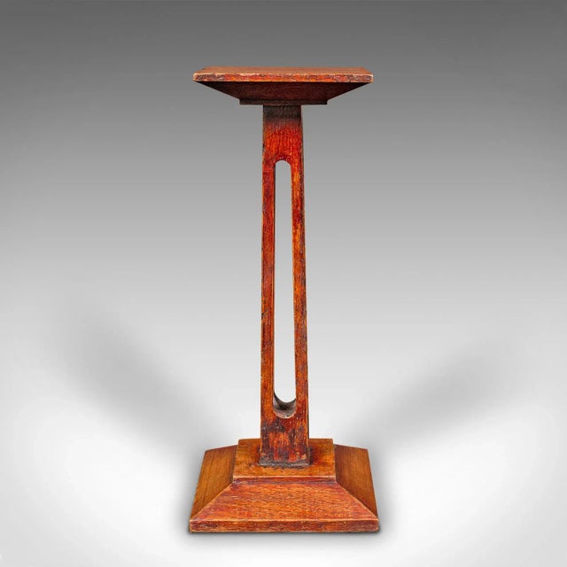 This is a small antique statue stand. An English, oak pedestal or torchere column, dating to the late Victorian period,...