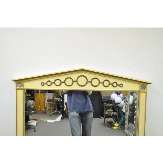 Vintage Hollywood Regency Italian Neoclassical Style Brass Ring Cream Painted Wall Mirror. Item features painted wood...