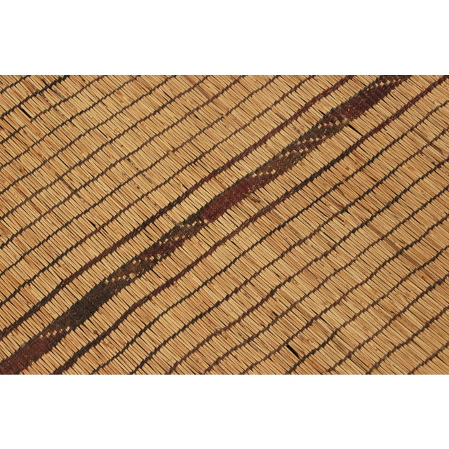 This vintage rug and floor covering is a 3x10 Tuareg runner mat from the nomadic tribe of the same name. Handwoven with...