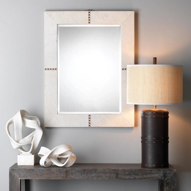 This table lamp offers a handsome masculine touch for any room. With its bold barrel silhouette and vintage leather...