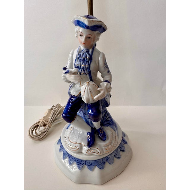 Add a touch of Mid-Century elegance to your space with this beautiful porcelain figurine lamp. Featuring a finely detailed...