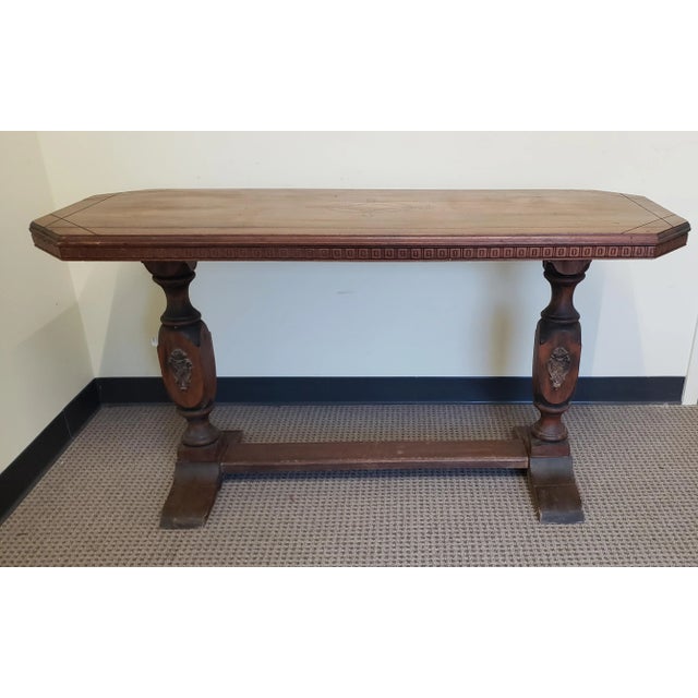 19th Century Baroque Style Walnut Trestle Base Library Table. Measures 53.5" in width, 20" in depth and stands 28.5" tall....