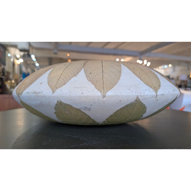 Add a touch of organic Mid-Century Modern charm to your space with this unique ceramic "seed pod" vase. Featuring a low-...