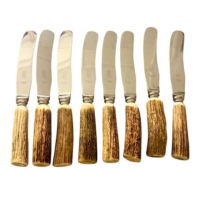 A handsome set of eight vintage Scottish butter knives by J. Fraser Horncraft of Braemar, each featuring a naturally...