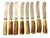 A handsome set of eight vintage Scottish butter knives by J. Fraser Horncraft of Braemar, each featuring a naturally...
