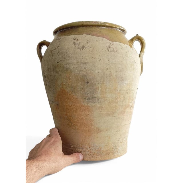 Antique large Spanish terracotta olive oil handled jar or vase, handmade towards the end of the 19th C. or beginning of...