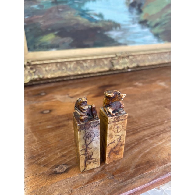 This is a pair of vintage Chinese soapstone seals, each intricately hand-carved and topped with zodiac animal figures -...