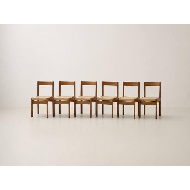 An elegant set of eight Scandinavian dining chairs with a clean, timeless design and high-quality craftsmanship. The...