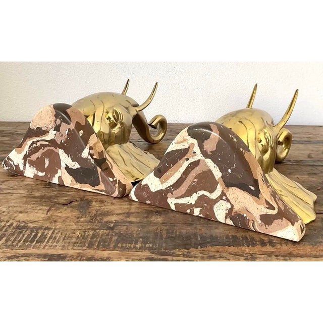 This striking pair of artisan-made wall brackets is a tour de force of Hollywood Regency glamour and "Safari Chic" design....